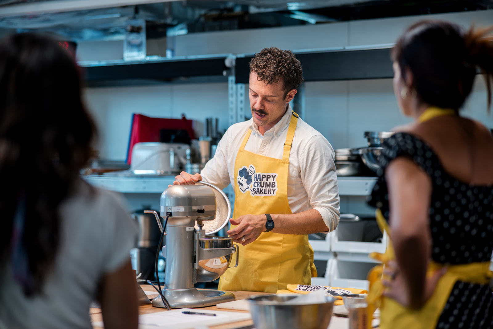 Professional baker demonstrating cookie dough during a corporate away day in London