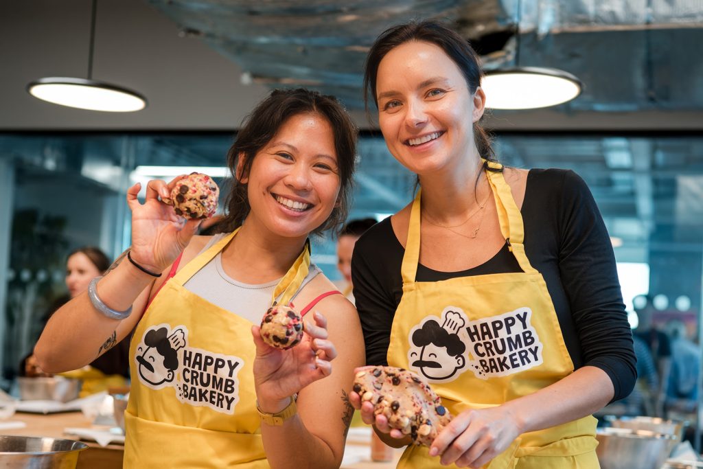 Corporate team presenting and judging finished cookies during a London away day activity